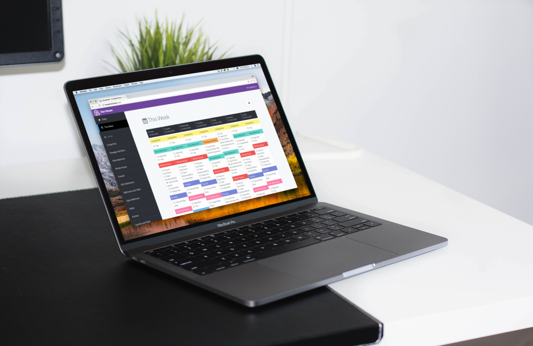 Household calendar and task dashboard displayed on a laptop