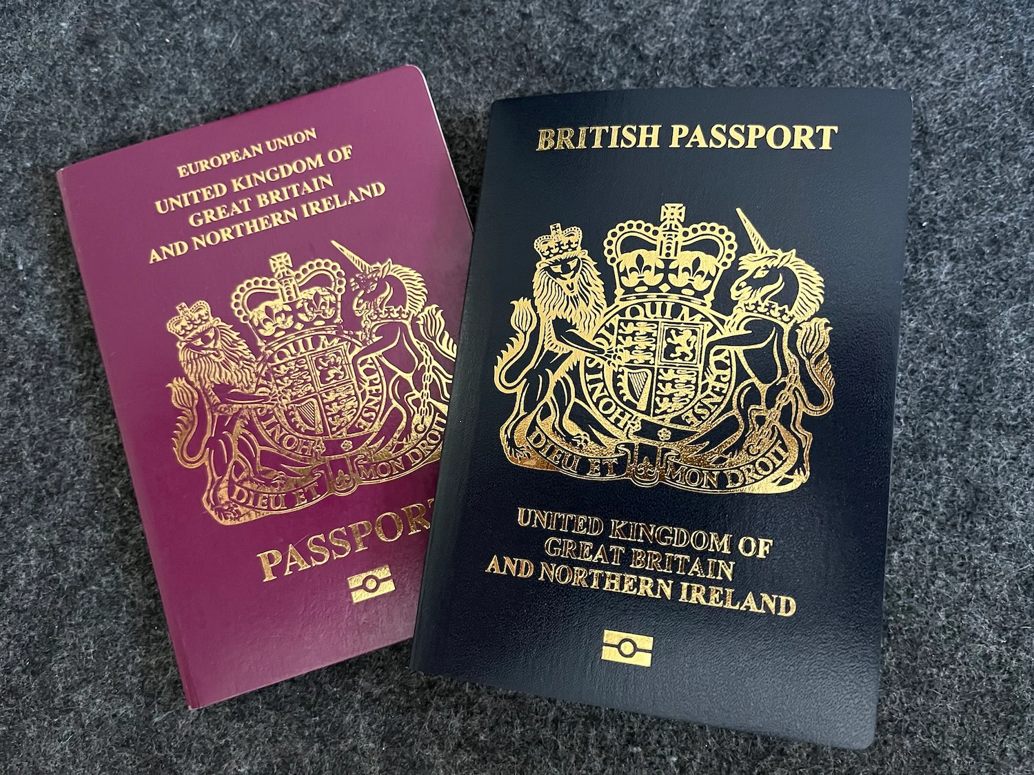 A burgundy UK and Northern Ireland passport beside a new blue British passport